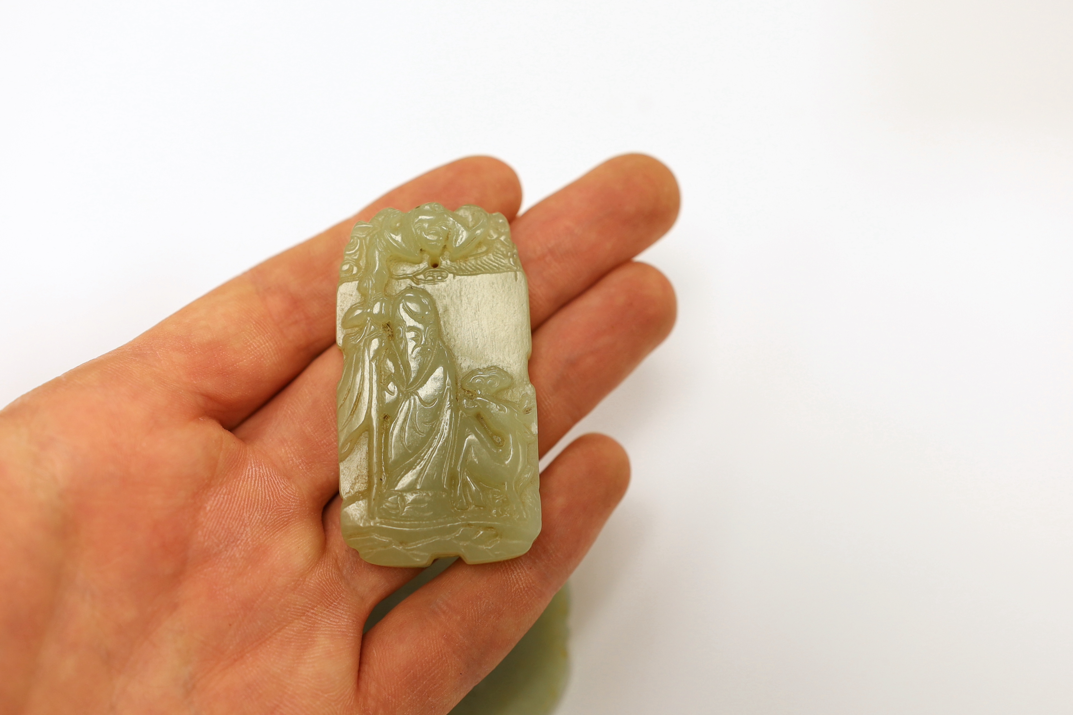 Two Chinese carved jade pendants, largest 6cm